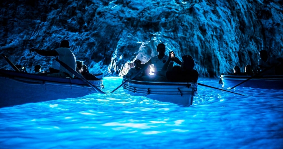 Photo:Boating in the famous blue grotto,Island of Capri 